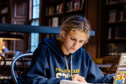 Student working at a desk in the OWHL