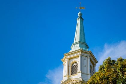 The spire of Cochran Chapel against a blue sky