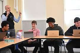 Ben Temple P’28 and students in the classroom