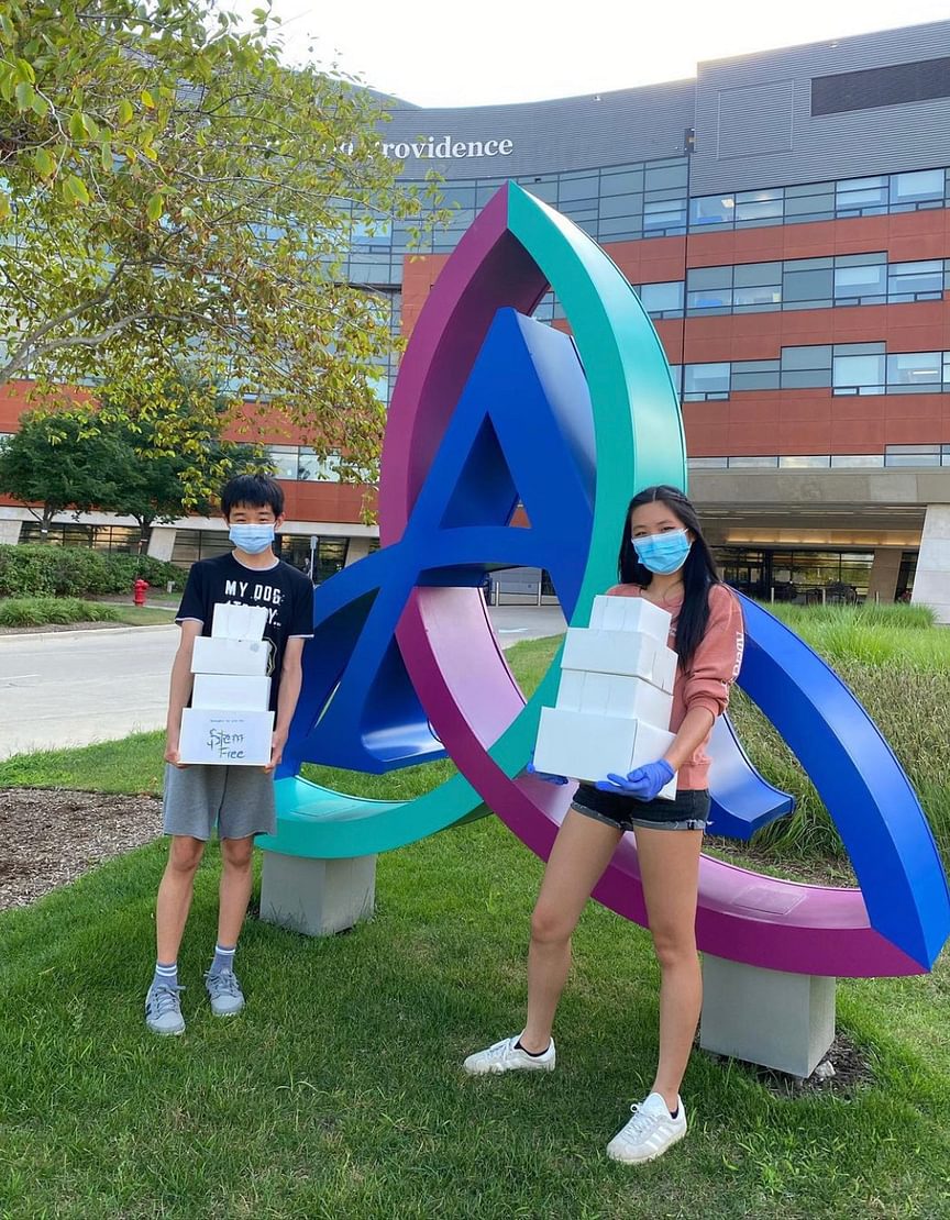 2 students collect unused food