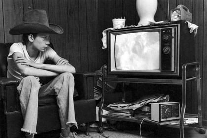 Photos from Portraits and Dreams: Johnny watching television, from Johnny’s Story