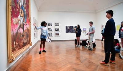 Two Students Looking at a Painting