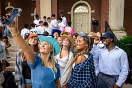 Students talking a selfie outside of Cochran Chapel