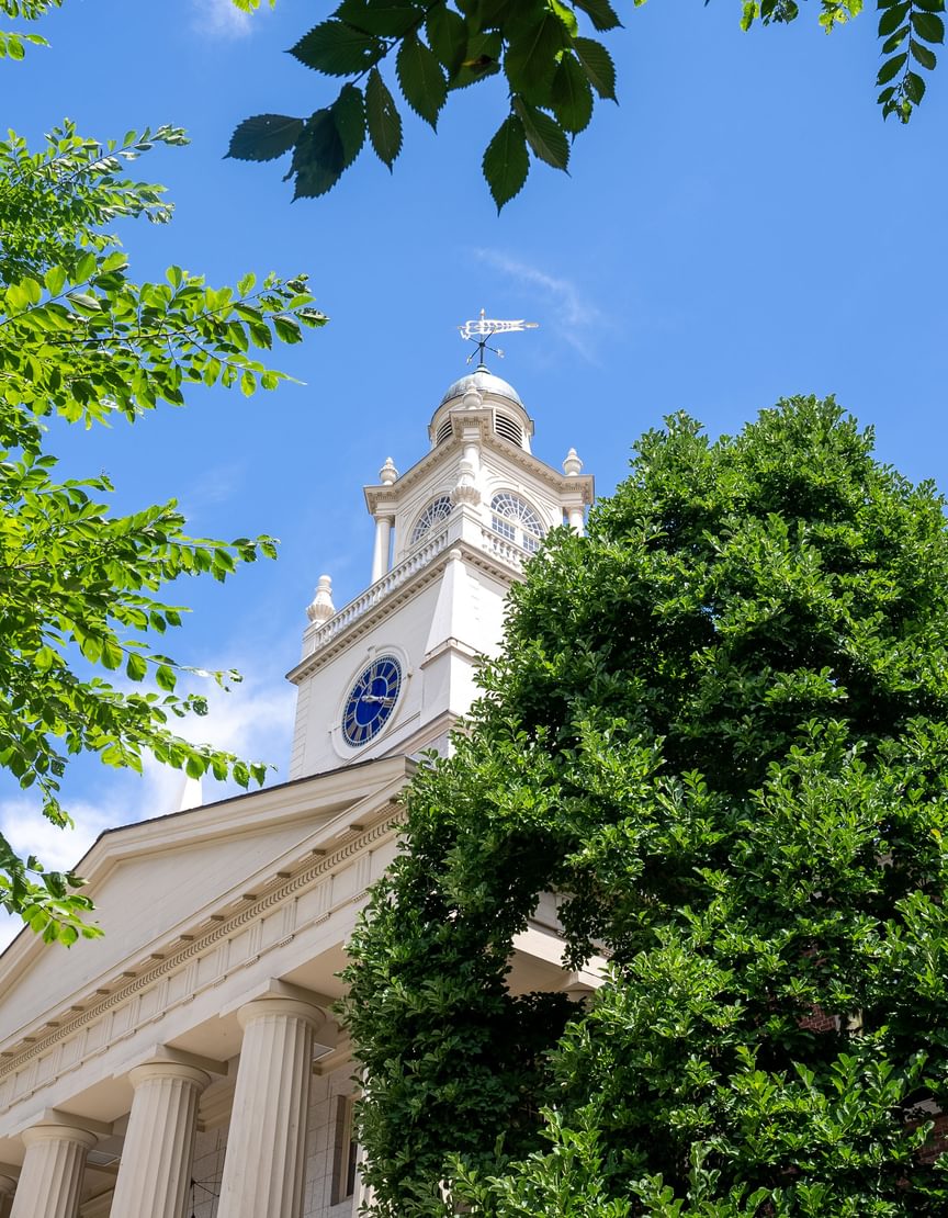 Samuel Phillips Hall with blue sky and trees