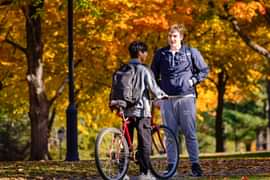 Two Andover students on campus with fall foliage