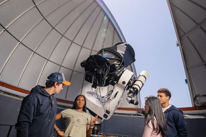 Faculty and students discuss astronomy at the Gelb observatory