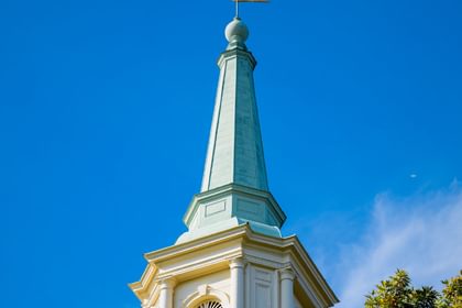 The spire of Cochran Chapel against a blue sky