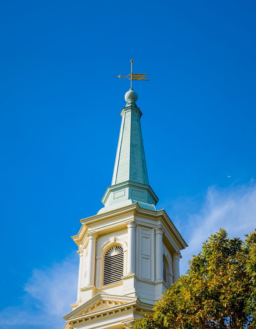 The spire of Cochran Chapel against a blue sky
