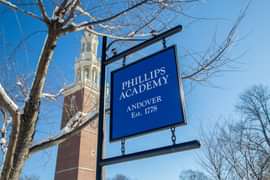 Phillips Academy sign against winter sky