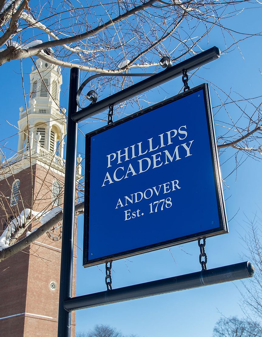 Phillips Academy sign against winter sky