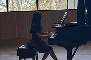 Student playing piano