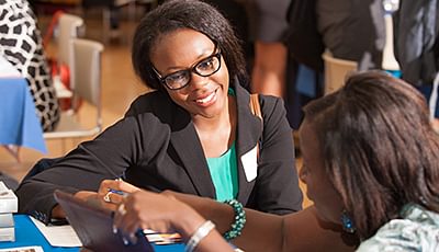 An IRT Student Filling Out Paper Work