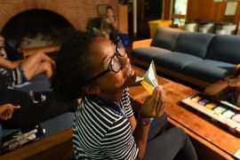 Girl in dorm playing cards