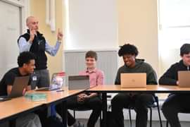 Dean of Faculty Ben Temple P’28 and students in the classroom