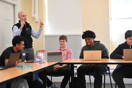 Dean of Faculty Ben Temple P’28 and students in the classroom